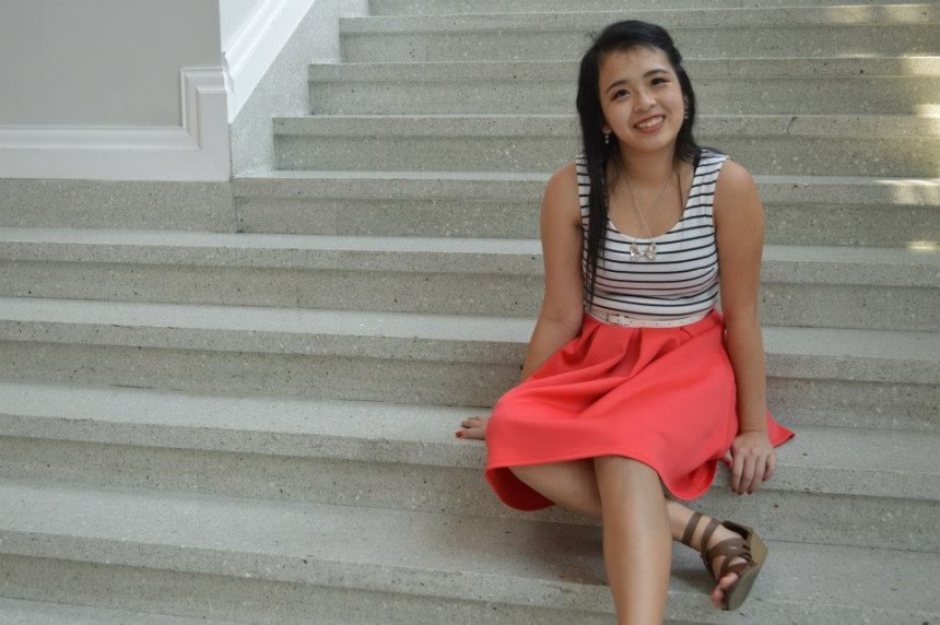 One of the photos I took as a rising senior in high school of me sitting on the stairs of a library. 