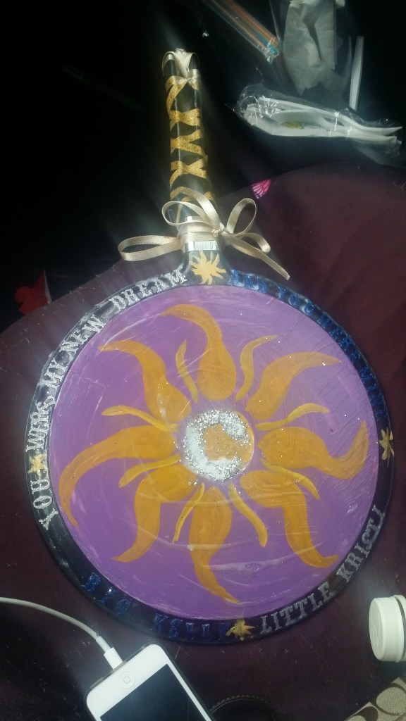 The sun from Tangled painted on the back of a pan