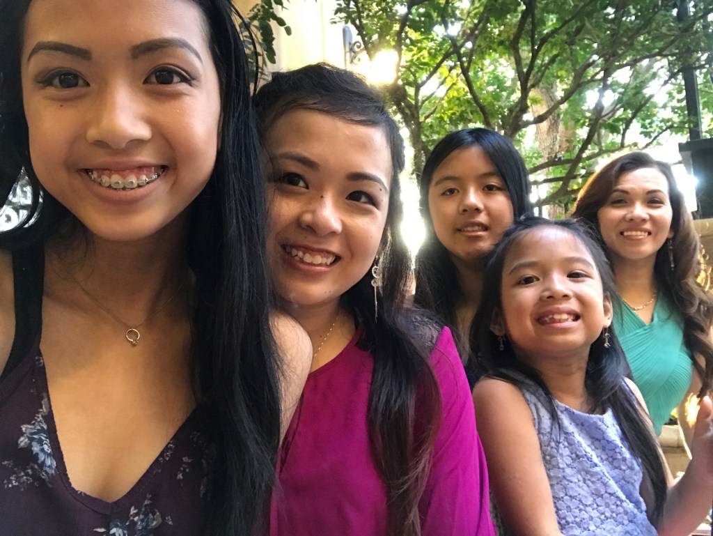 A selfie of me, my sisters, and my beautiful mother.