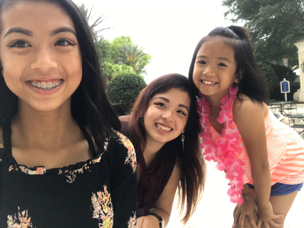 A selfie of me and my sisters on a sunny day.