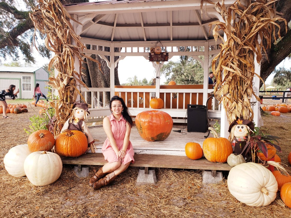 Me sitting in a gazebo with some pumpkins.