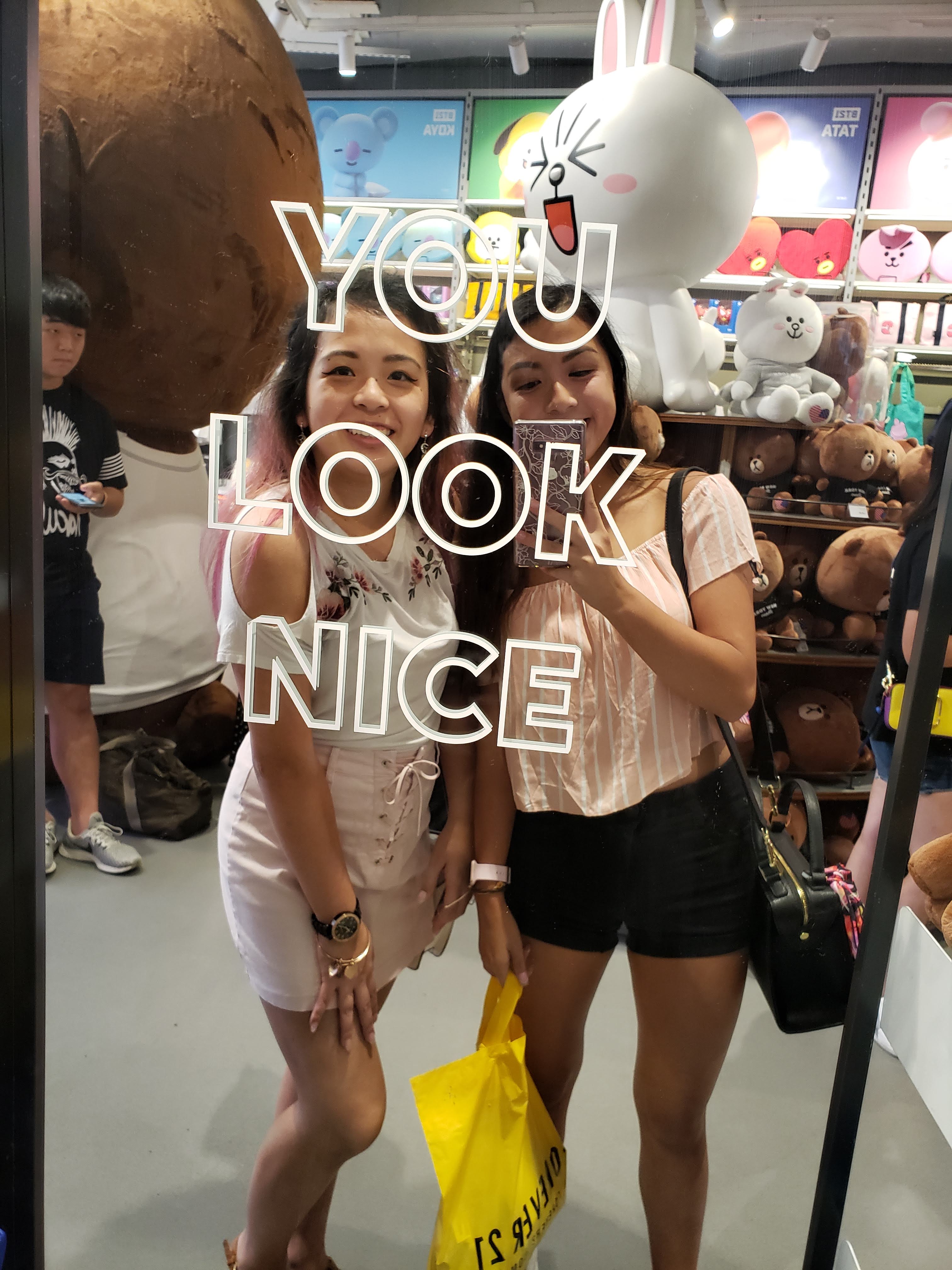 A selfie of me and Tina when we're out shopping in Times Square.