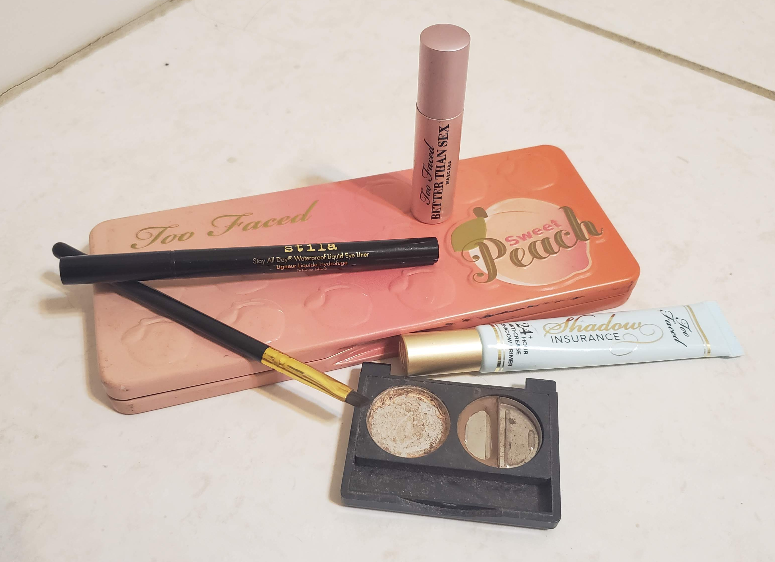 Pictured: ULTA Brow Duo, Too Faced Shadow Insurance, Stila Stay All Day Waterproof Liner, Too Faced Better Than Sex Mascara, and an angled brush.