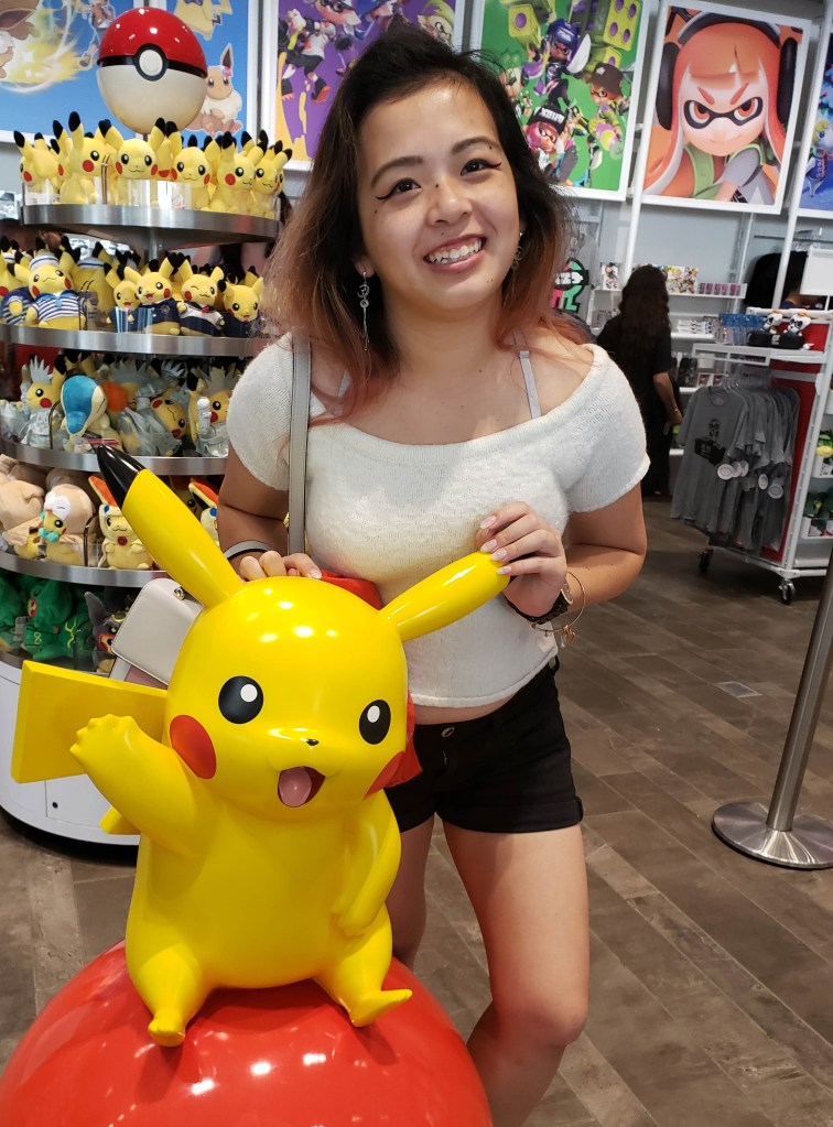 Here's a photo of me posing with a Pikachu statue in the Ninetendo Store in New York City.