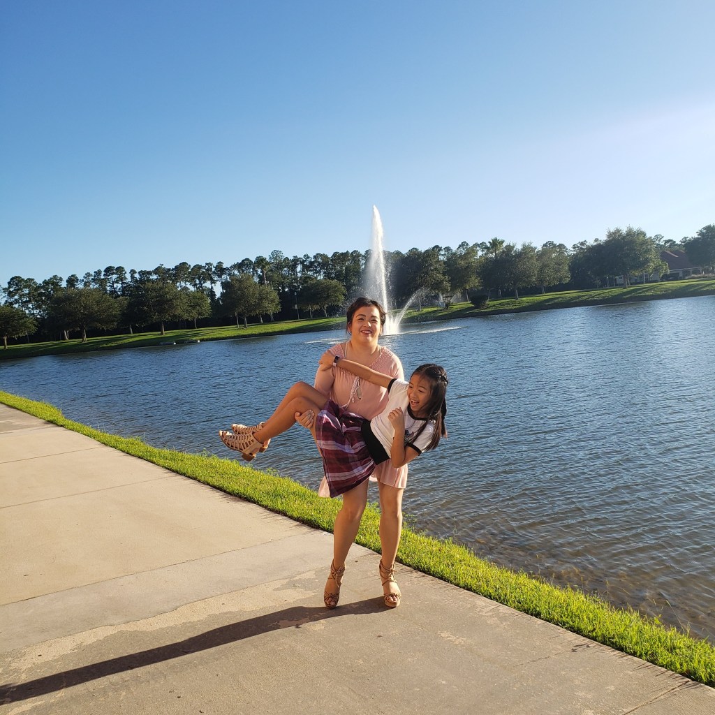 A photo of my baby sister and I back in March. We dressed up and walked around the neighborhood to take pictures. I'm surprised I didn't fall into the lake swinging her around in those heels.