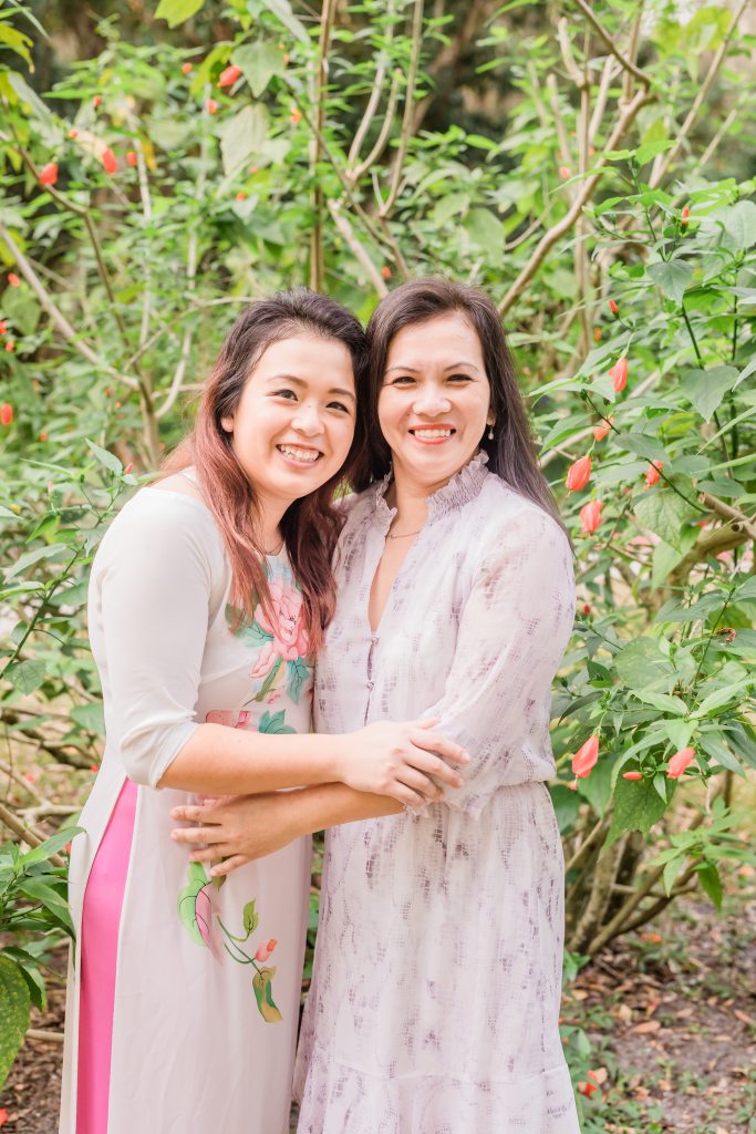 For the family photo shoot, I wanted to wear a traditional Vietnamese dress (ao dai) to showcase how proud I am of my culture. Here is a photo of me and my mom. We could practically be mirror images of each other.