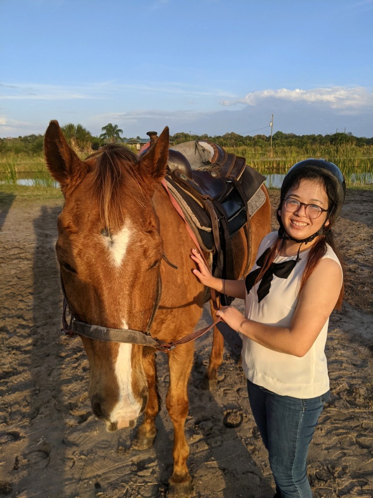 It's me and the horse I rode! I would like to think that his eyes are closed because he felt really at peace with me.