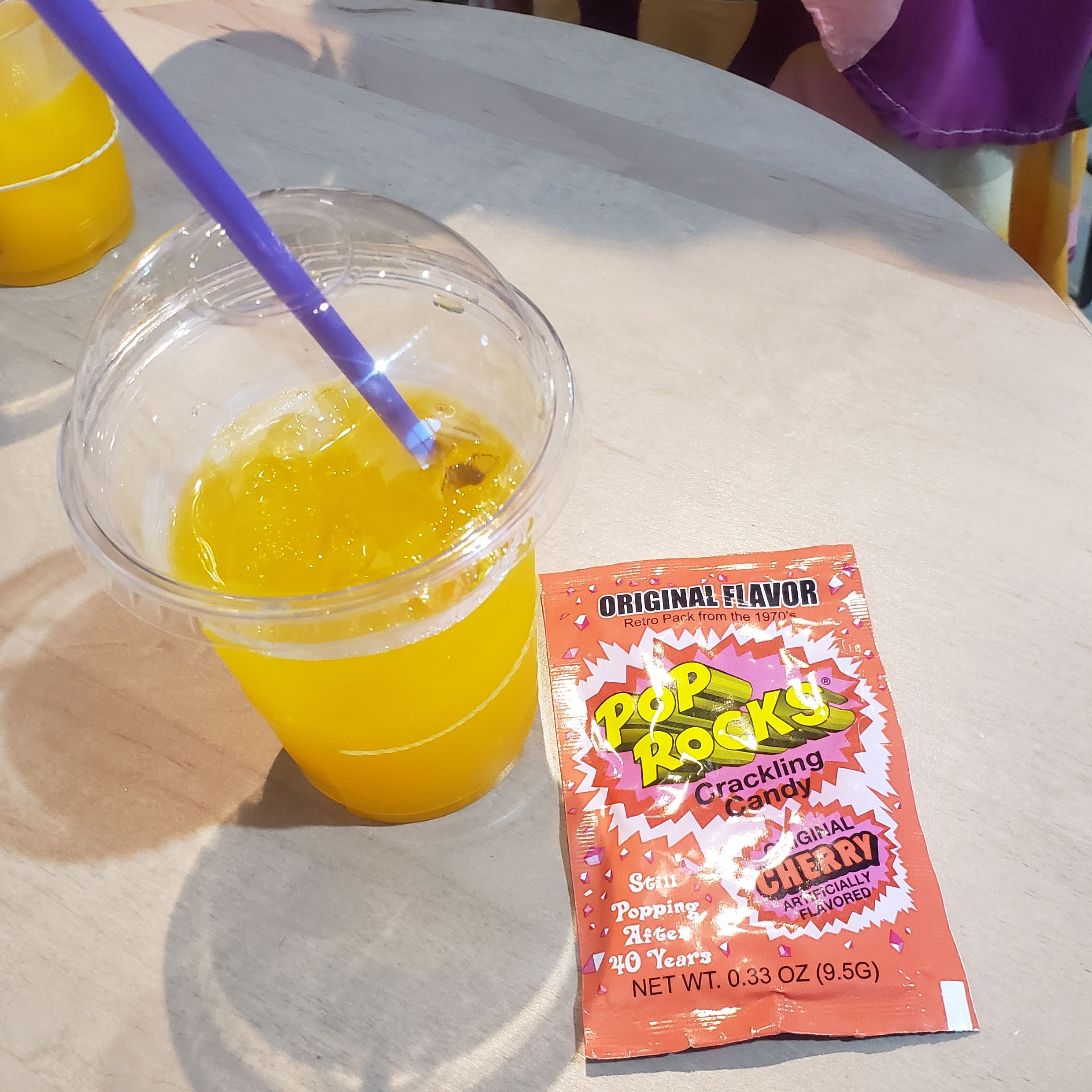 At the party, they had food trucks outside, and then these were the party snacks inside. Tang is a drink that I hadn't tried before, but it's pretty refreshing. And then they had Pop Rocks, which are a classic,