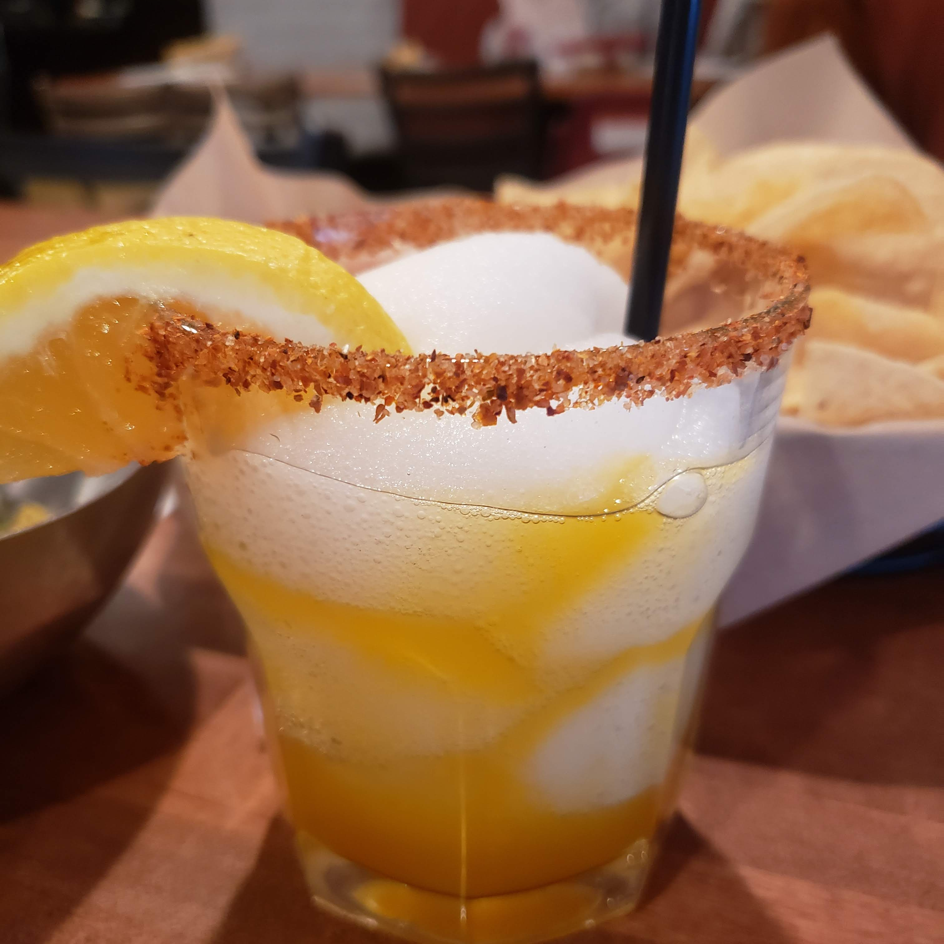 Let me tell you, they make magical margaritas. I got a mango margarita, and while I usually like a sugar rim, they put Tahin on theirs here, which was just a chef's kiss from me.
