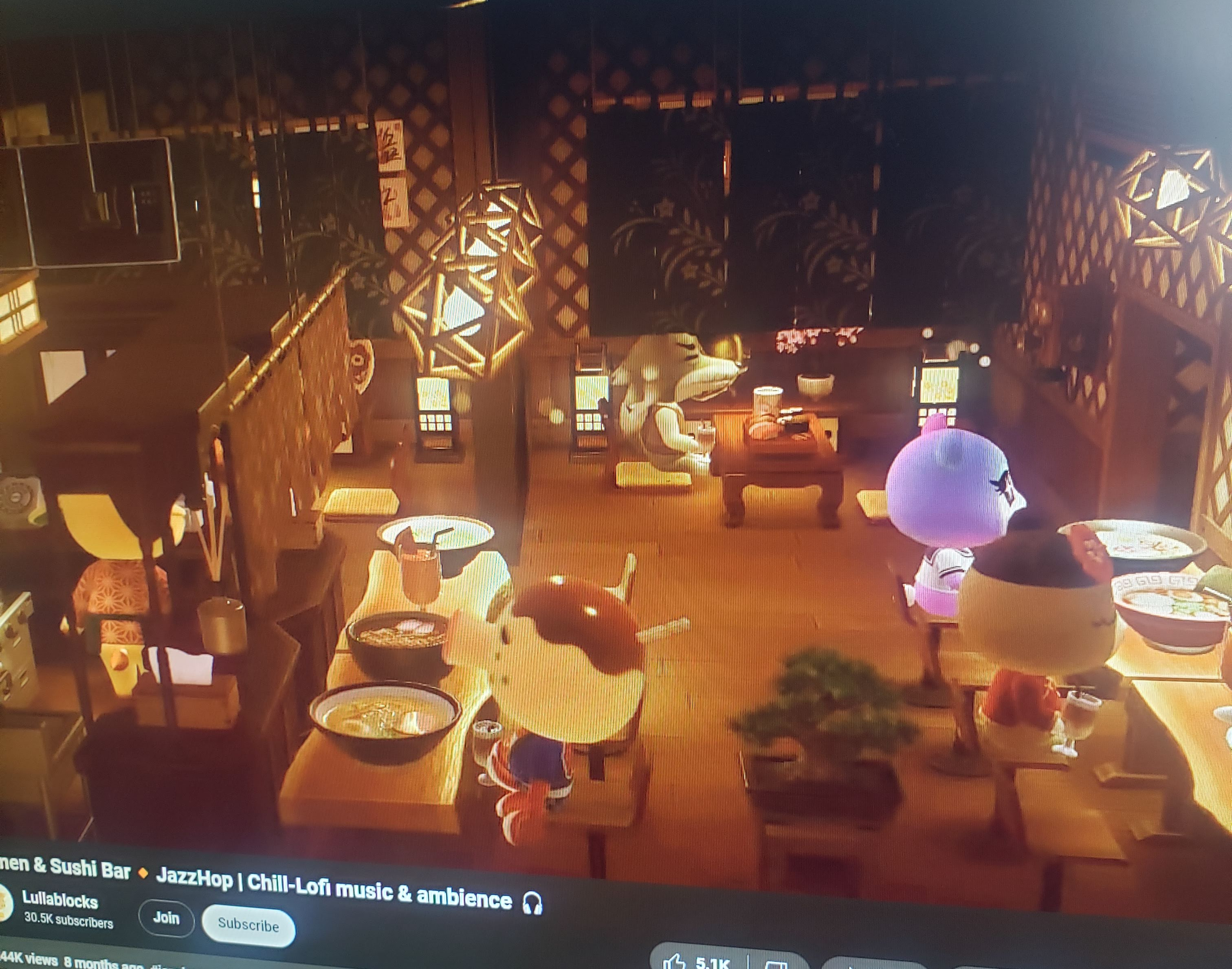 A photo of one of my computer screens when I was a student. The screen shows a video of an Animal Crossing restaurant, and the title says there's Jazz and Lofi music playing.