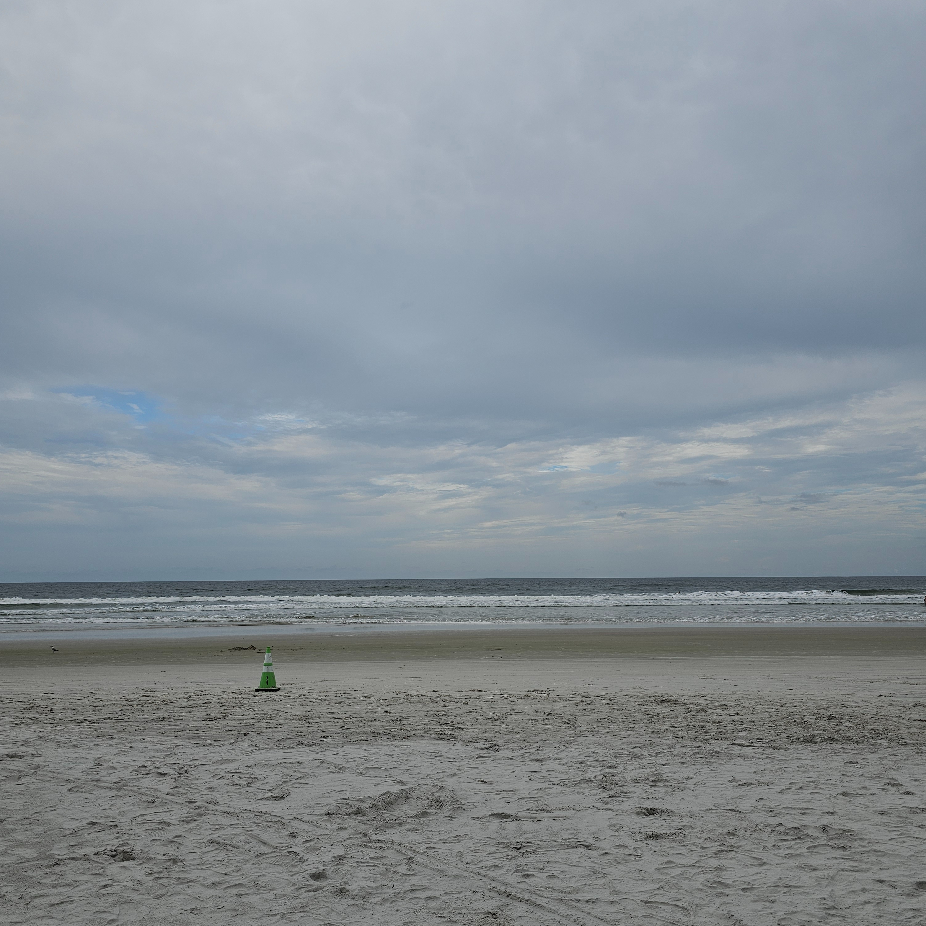 A photo of the sand, ocean, and sky on the day that I went to the beach a second time.