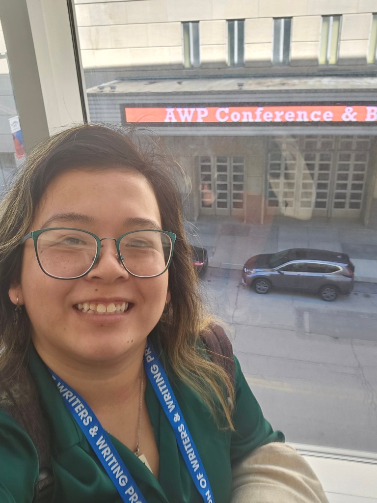 A selfie I took somewhere in the Conference Center in Kansas City, Missouri. It might not be the most flattering photo of me, but I was happy to get the little banner in the selfie.