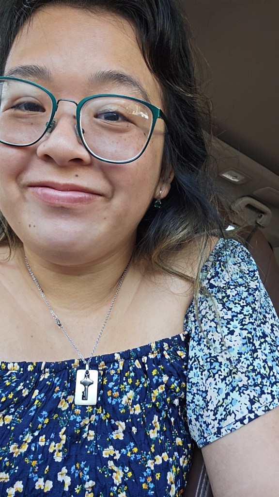 I took this selfie in the car. I like how the color of my green glasses plays off of the shades of blue and green in the dress that I'm wearing.